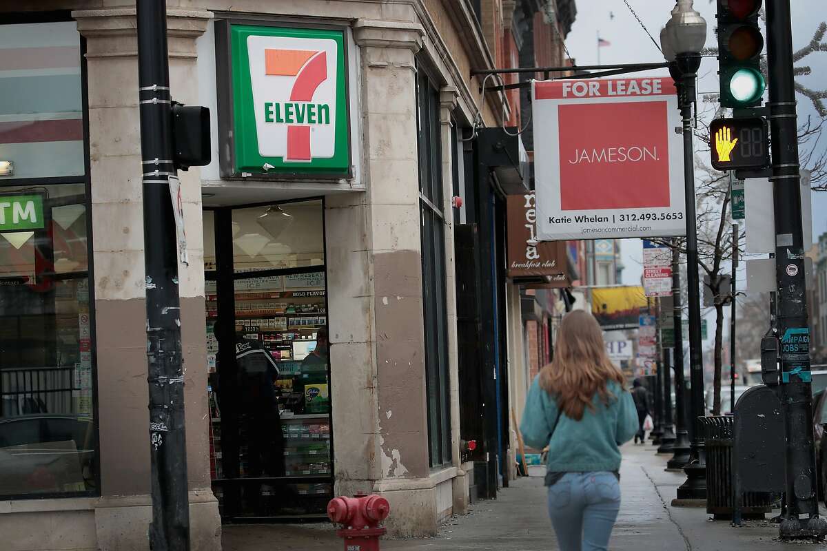 Pedestrians walk past a 7-Eleven store on January 10, 2018 in Chicago, Illinois. “Due to existing landscaping, street visibility and the quick decision-making associated with this type of convenience use, 7-Eleven has simultaneously filed for a variance regarding the location and size of the pole sign permitted,” the application said. Neighbor Rolf Obin sent a letter to the commission pointing out that the Duchess restaurant currently attracts more long-term visitors as a “sit-down, take-out restaurant versus more transient clientele. He argued that six gas station islands will bring more unneeded traffic into town. “With 24-7 service, and close proximity to the I-95 exit, the vehicles coming off the highway poses safety and security concerns to the town of Darien,” he said. Obin also said a Darien police officer “lost his life” at the Duchess location. In 1981, officer Kenny Bateman was shot and killed while investigating a commercial burglar alarm activation early in the morning at a local fast food restaurant. It is the only unsolved murder of a Connecticut police officer on record. Bateman, a seven-year veteran of the Darien Police Department, was 34 at the time of his death.