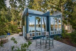 Modern Kitsap home with wall of glass asks $795K