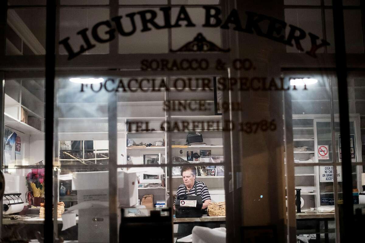 Josephine Soracco works before dawn to prepare Liguria Bakery for customers on Friday, Jan. 5, 2018, in San Francisco.