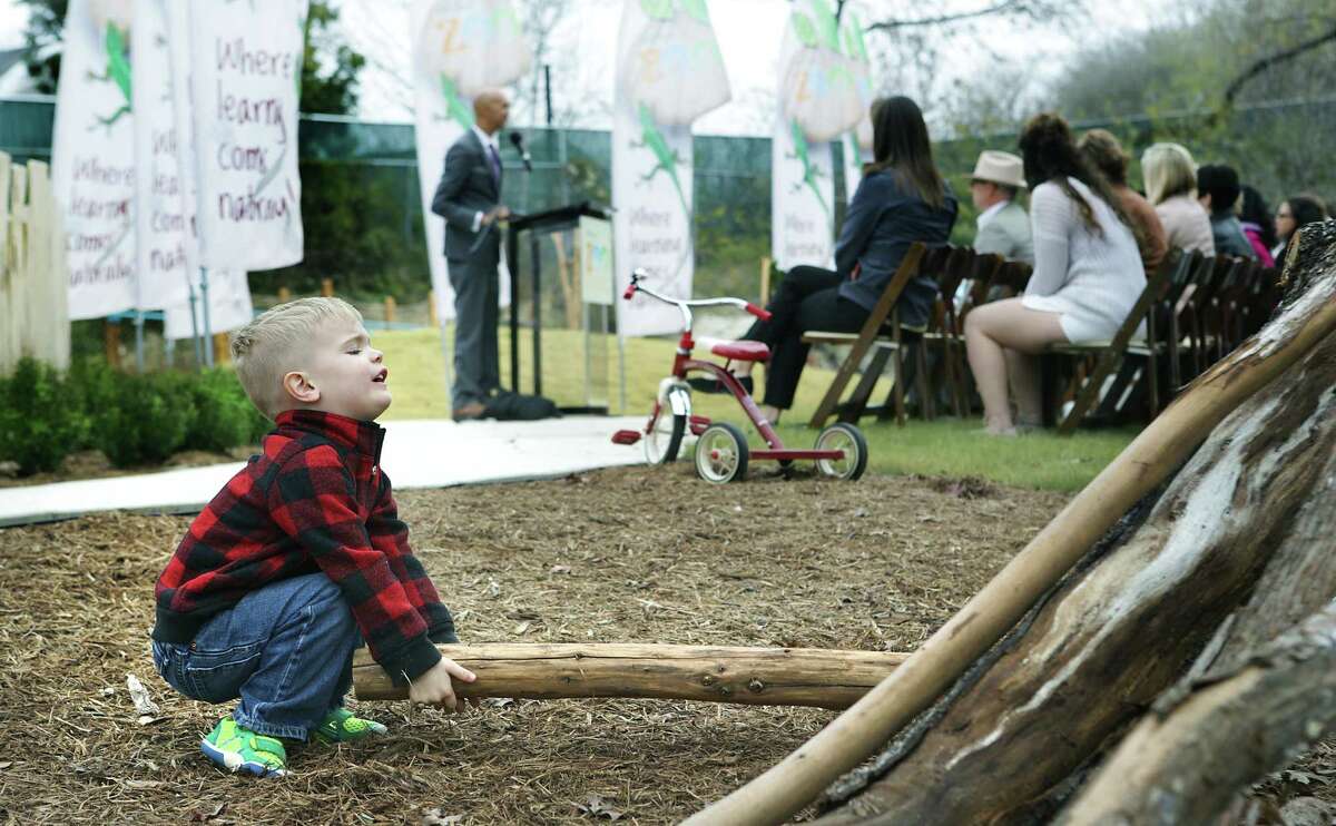 Jude Knueve, 3, a future student at Will Smith Zoo School, plays with logs during The San Antonio Zoo official opening of the Will Smith Zoo School that fosters an appreciation of animals and plants with a nature-based curriculum, outside activities and an exploration of the zoom, on Wednesday, Jan. 10, 2018.