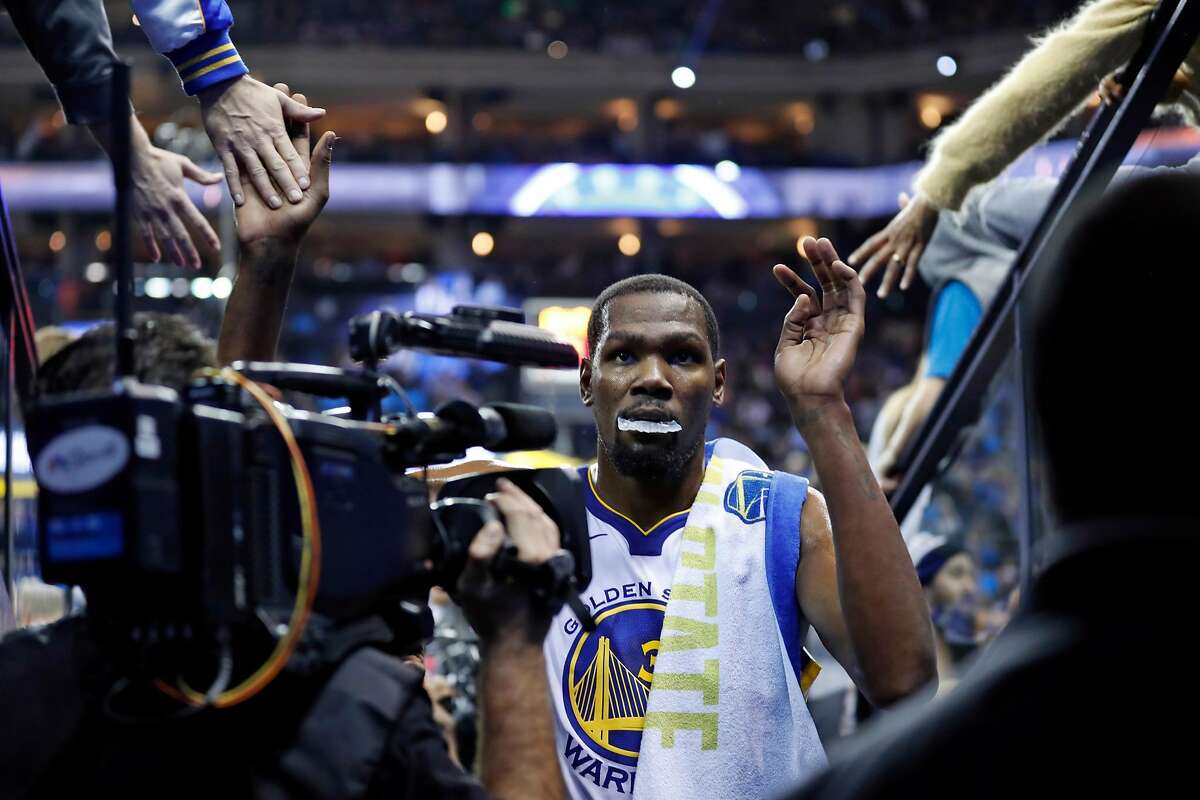Golden State Warriors' Kevin Durant heads to the locker room at halftime after scoring his 20,000th career point on a 2nd quarter jumper against Los Angeles Clippers during NBA game at Oracle Arena in Oakland, Calif., on Wednesday, January 10, 2018.