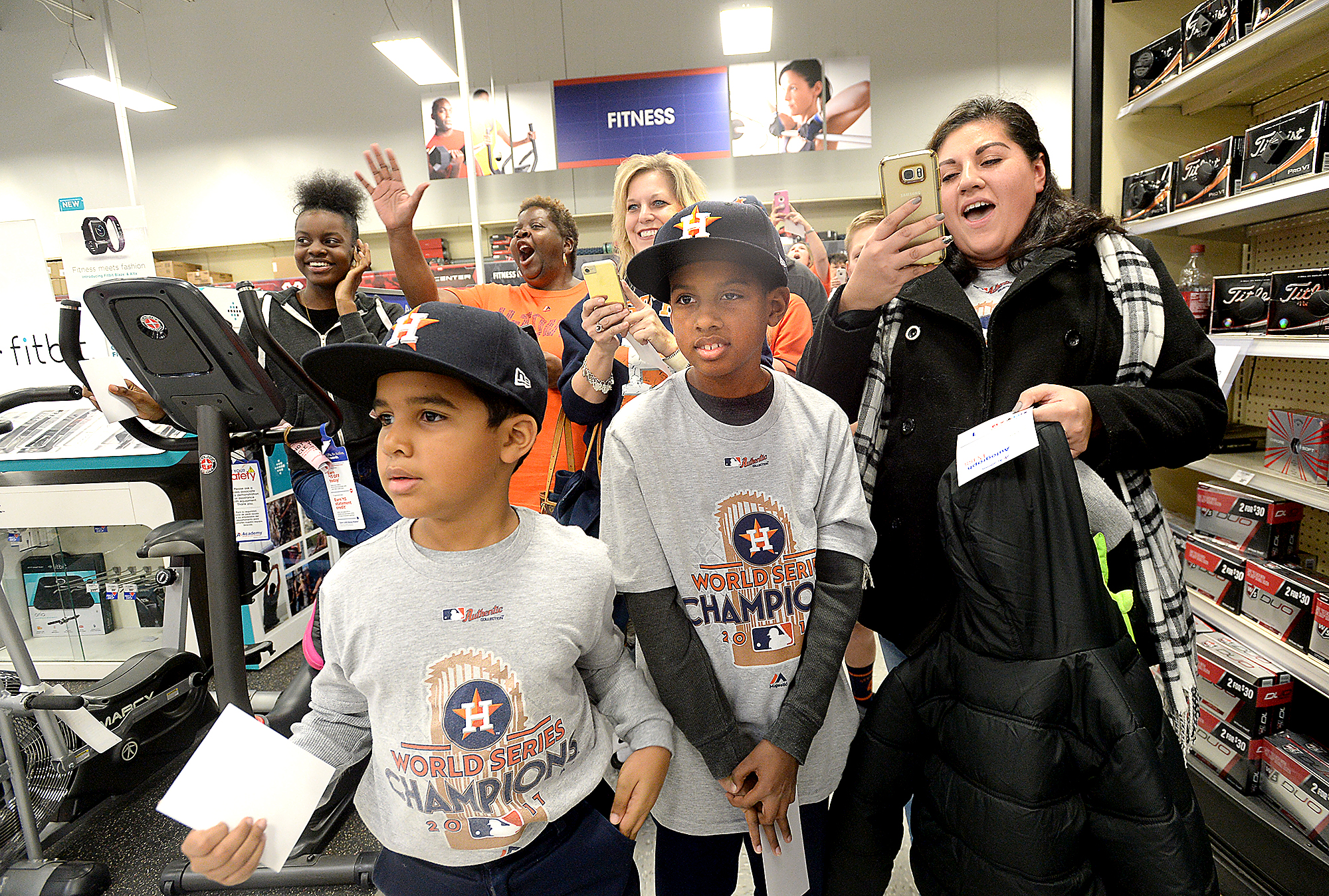 Houston Astros players shop with kids at Academy during Astros-Caravan stop