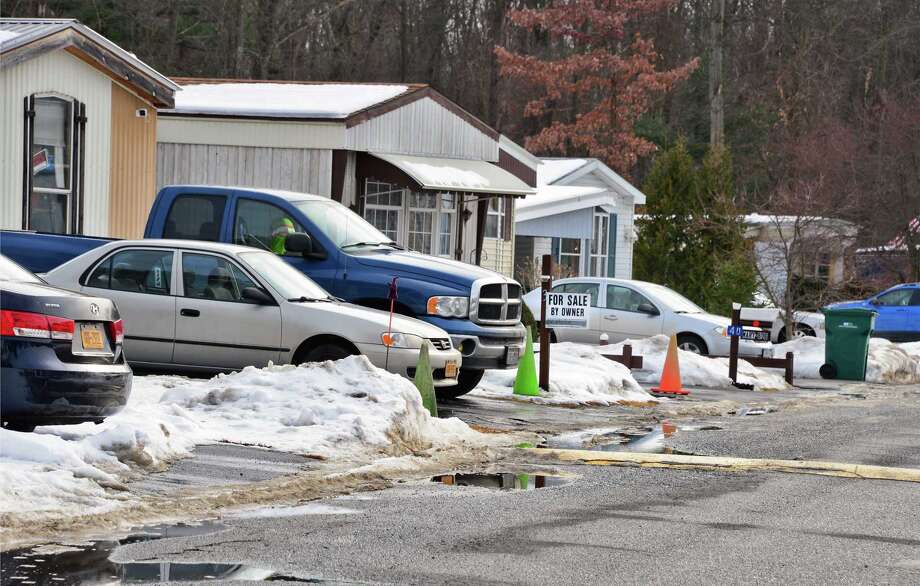 DEC team cleaning Malta Gardens oil spill Times Union