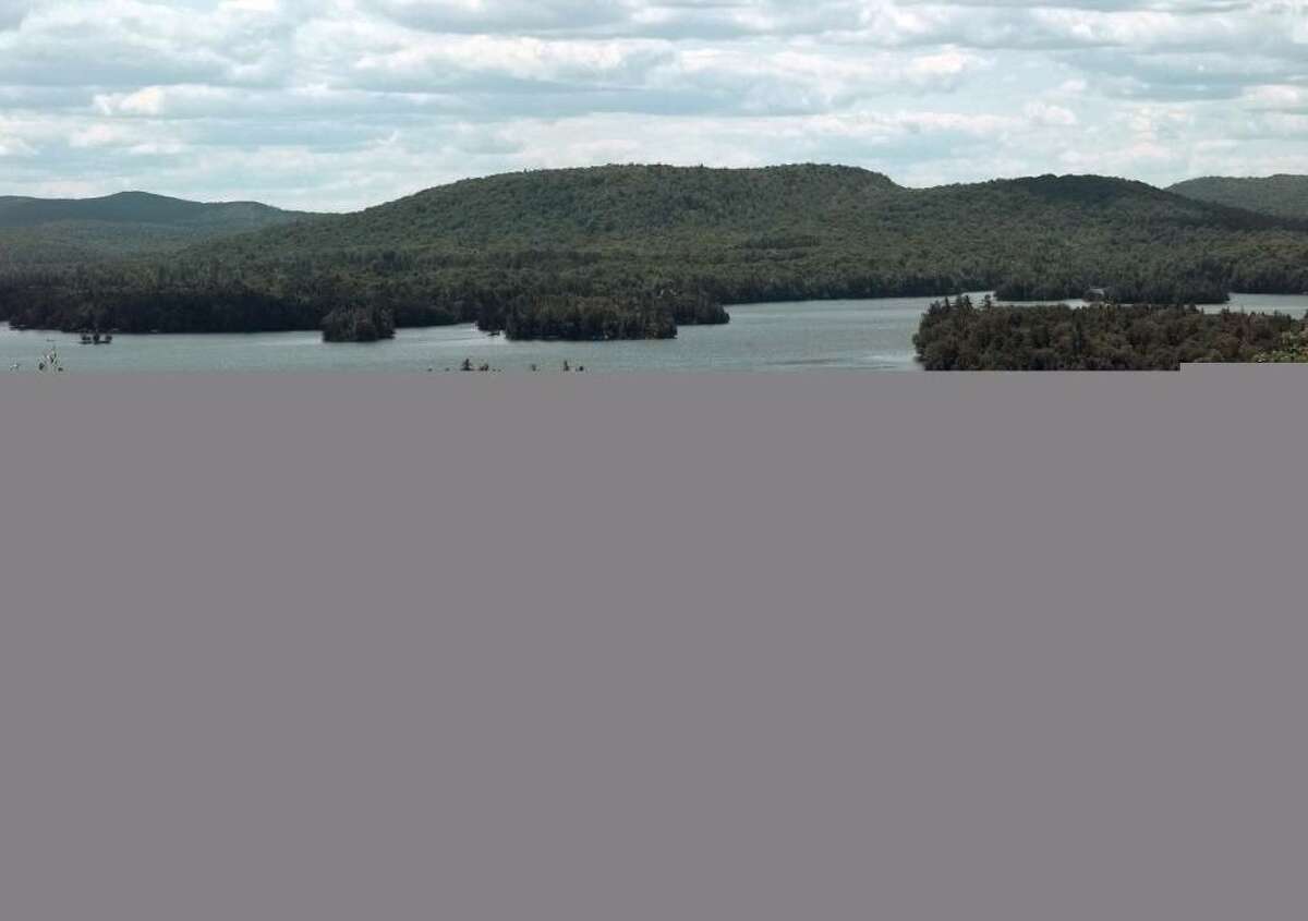Forests surrounding Blue Mountain Lake in the Adirondacks can?t soak up all the greenhouse gas emissions generated by residents. Home heating during the long winter is a major polluter, a study says. (Times Union ARCHIVE)