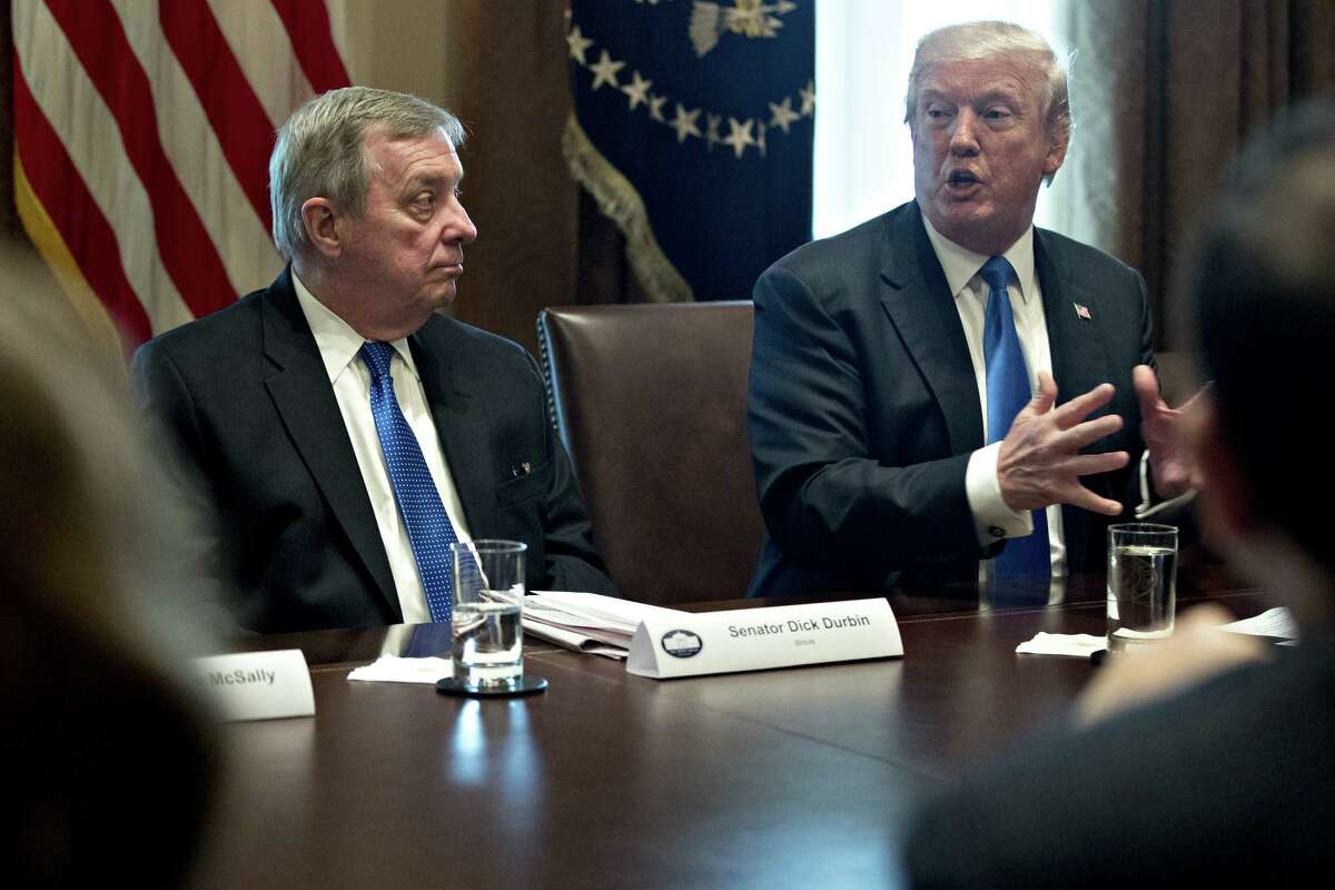President Donald Trump speaks while Sen. Dick Durbin, D-Ill.(left) listens during a meeting with bipartisan members of Congress on immigration in the Cabinet Room of the White House in Washington, on Jan. 9, 2018.