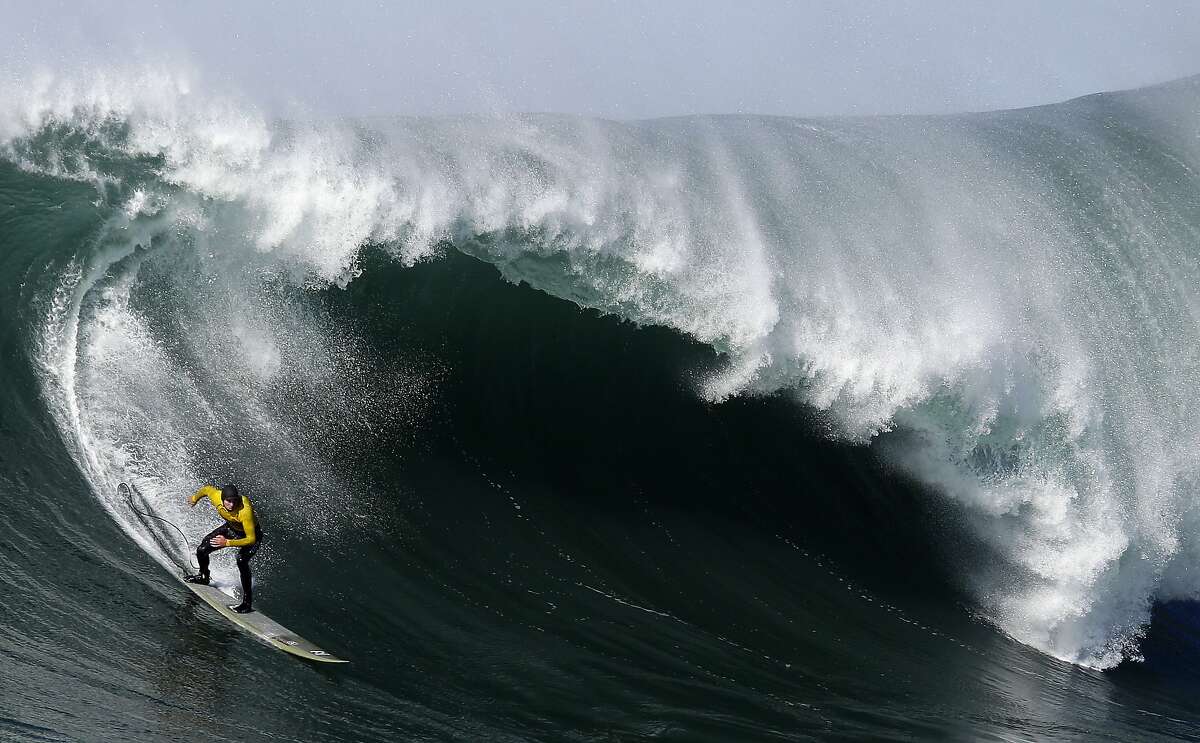 FILE -- In this Jan. 20, 2013, file photo, Greg Long competes during the third heat of the Mavericks surf competition in Half Moon Bay, Calif.