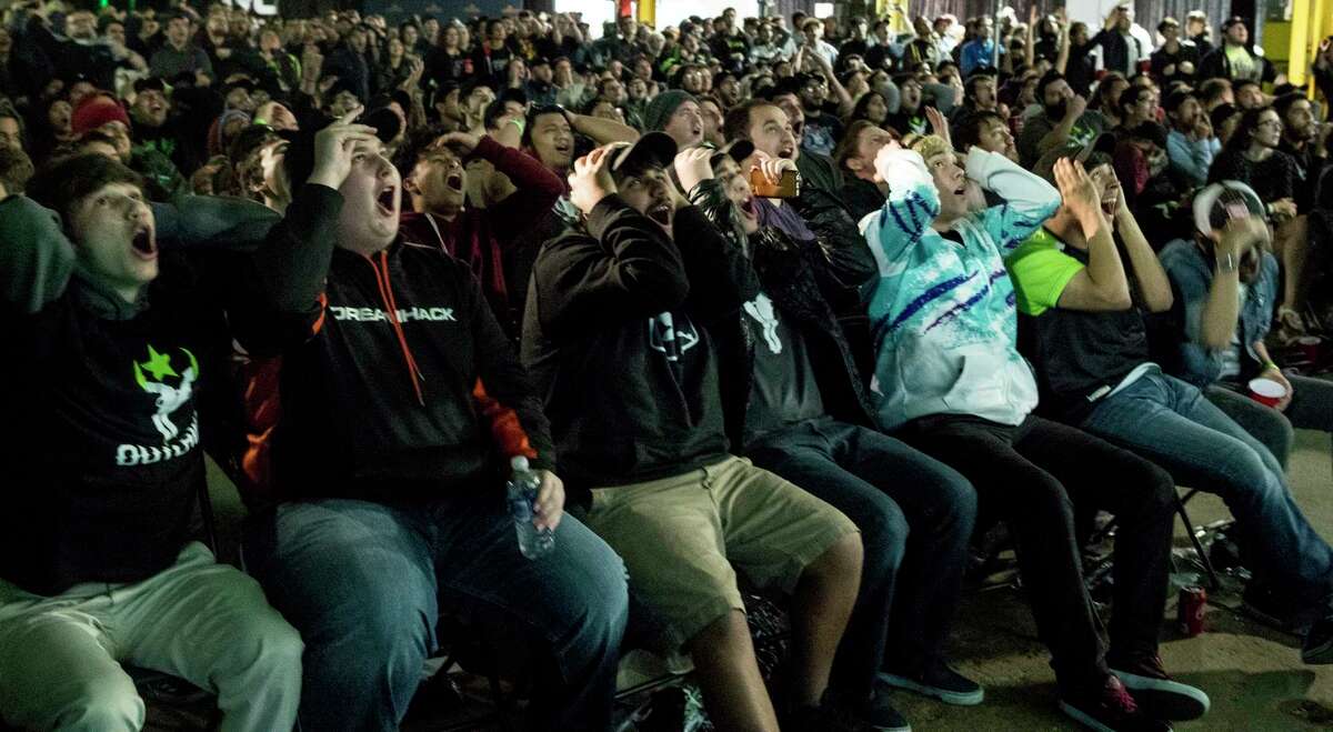 Houston Outlaws fans cheer during a watch party for the Outlaws, an eSports team representing the city, at The Cannon on Thursday, Jan. 11, 2018, in Houston. ( Brett Coomer / Houston Chronicle )
