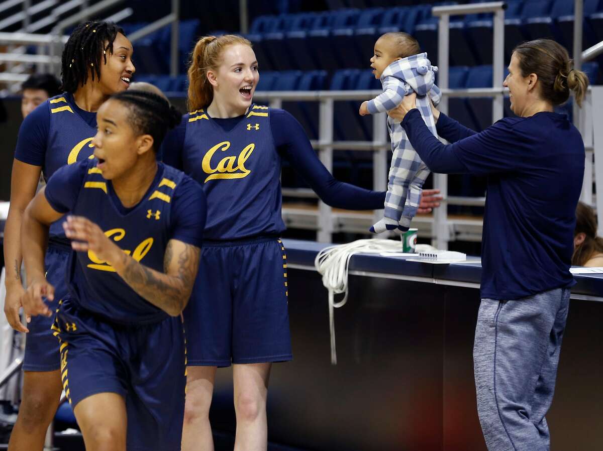 Head coach Lindsay Gottlieb�s 6-month-old son Jordan attracts the attention of players during a Cal women's basketball practice at UC Berkeley on Wednesday, Nov. 29, 2017.