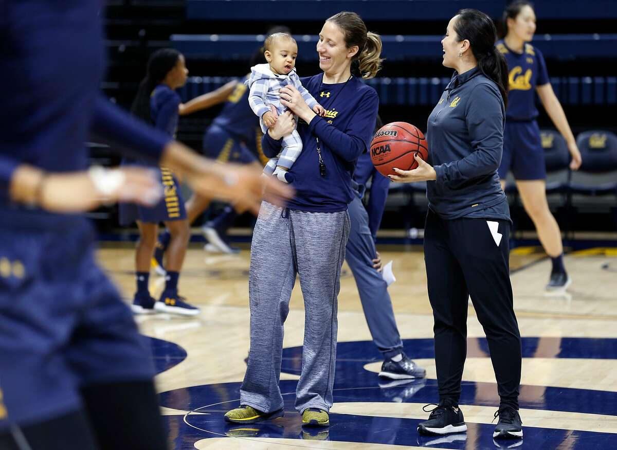 Head coach Lindsay Gottlieb holds her 6-month-old son Jordan while conducting a Cal women's basketball practice with assistant coach Kai Felton (right) at UC Berkeley on Wednesday, Nov. 29, 2017.