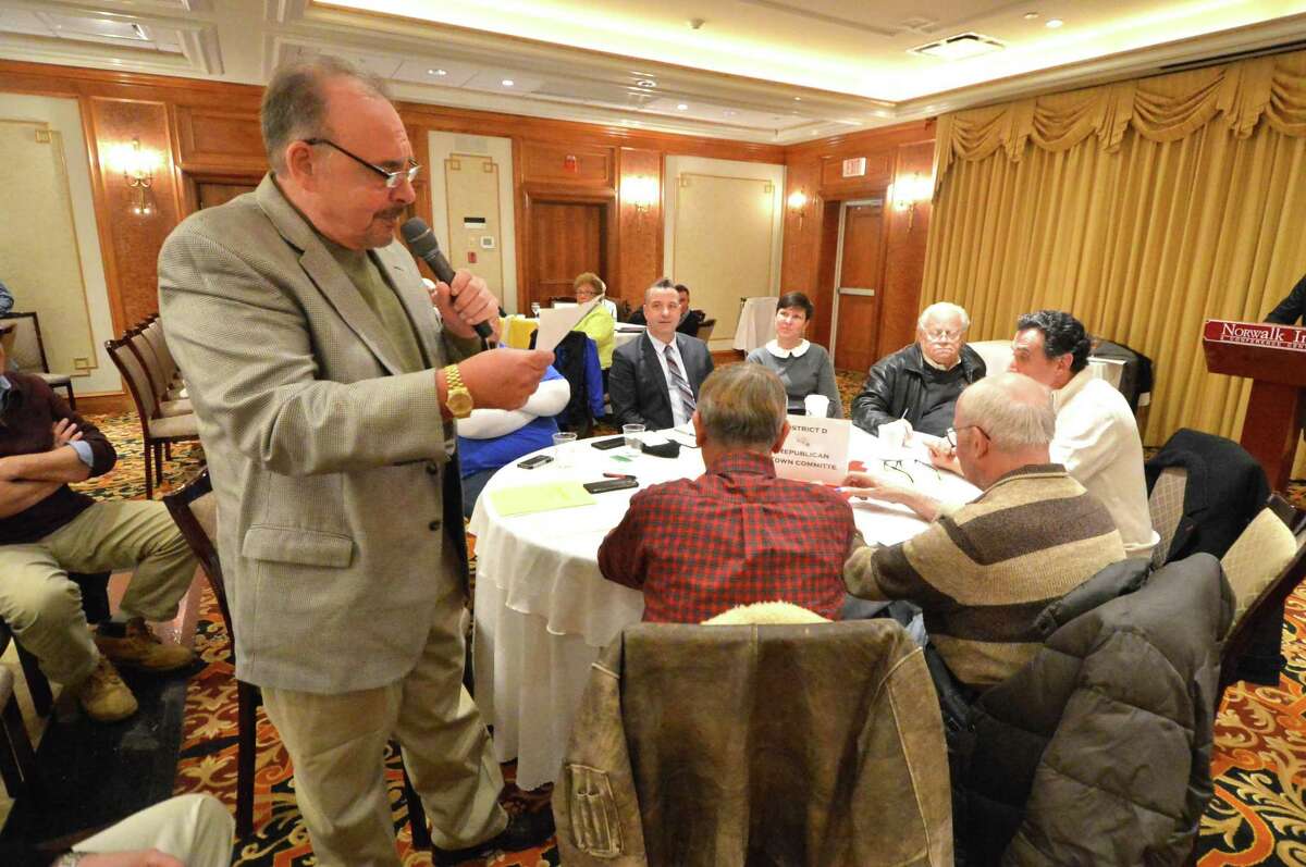 Republican Town Committee Vice Chairman and District D Chairman John Romano announces the names of the members in his district during the RTC caucus on Wednesday January 10, 2018 at the Norwalk Inn and Conference Center in Norwalk Conn.
