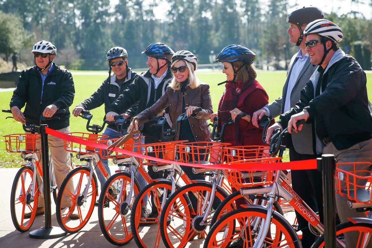 The Woodlands Township Board of Directors cut a ribbon to introduce a new dockless bike sharing program, MoBike, at Town Green Park Friday, Jan. 5, 2018 in The Woodlands. The bikes don't need to be returned to a specific location at the end of a users ride and can be unlocked by a new user with phone app. ( Michael Ciaglo / Houston Chronicle)