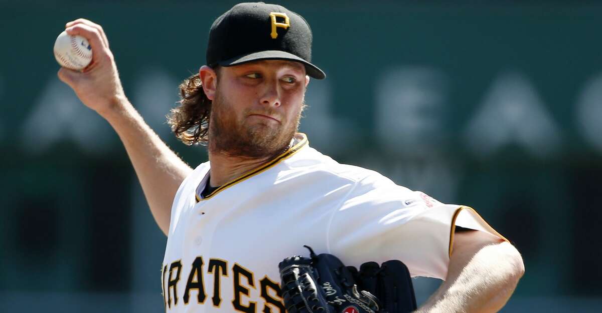 FILE - In this Sept 15, 2015, file photo, Pittsburgh Pirates starting pitcher Gerrit Cole warms up before a baseball against the Chicago Cubs in Pittsburgh. Pirates general manager Neal Huntington acknowledged a mistake was made in computing the young ace's salary and increased it to $541,000 for this year. But when Cole asked for more, he told the Pittsburgh Tribune-Review, the Pirates threatened to reduce his salary to the major league minimum, which states players with less than three years of service time must accept any salary at or over the minimum of $507,500. (AP Photo/Gene J. Puskar, File)