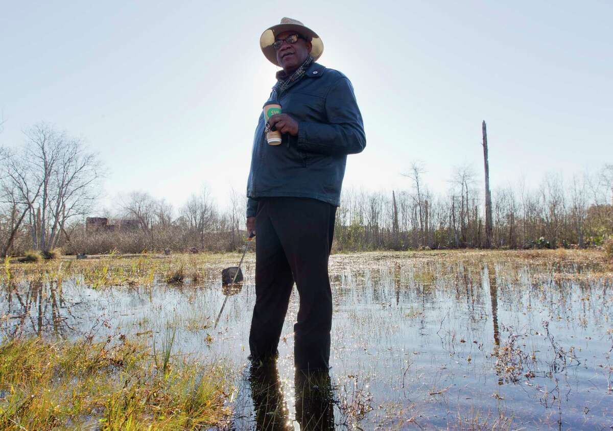 Elikah Easley, chairman of the Tamina Cemetery Project Community Development Corporation, walks through the flooded Sweetrest Cemetery, Saturday, Jan. 13, 2018, in the historic Tamina community. The 12-acer cemetery is the resting place for approximately 261 members of the founding Montgomery County community founded by freed slaves near The Woodlands.