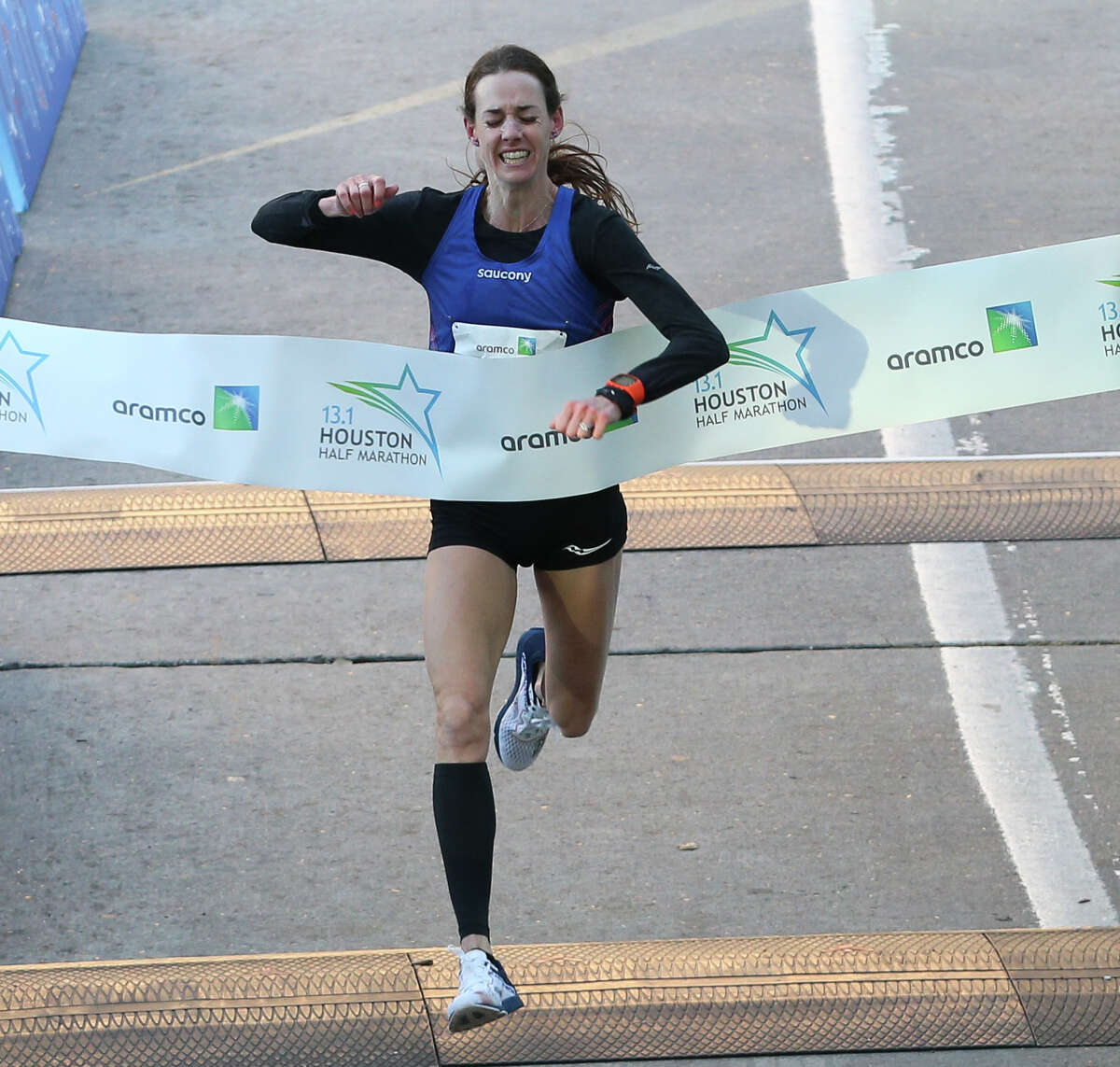 American runner Molly Huddle crosses the Aramco Half Marathon finish line on Sunday, Jan. 14, 2018, in Houston. Huddle broke the U.S. women's half-marathon record with a record in 1:07:26.