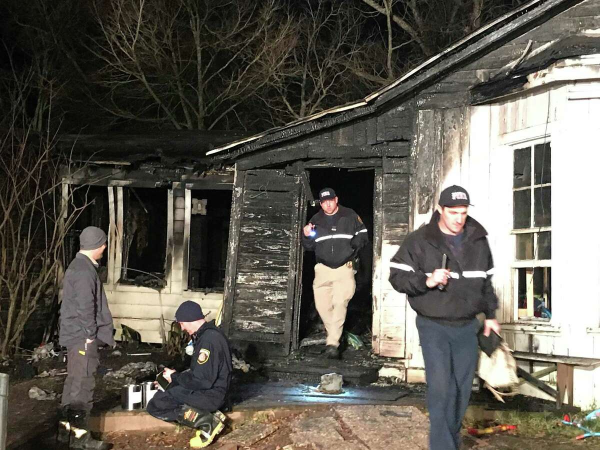 At least 11 people lived in home destroyed by a fire on Crooke St. Saturday afternoon in Conroe near Lewis Park, according to Conroe Fire Department officials.