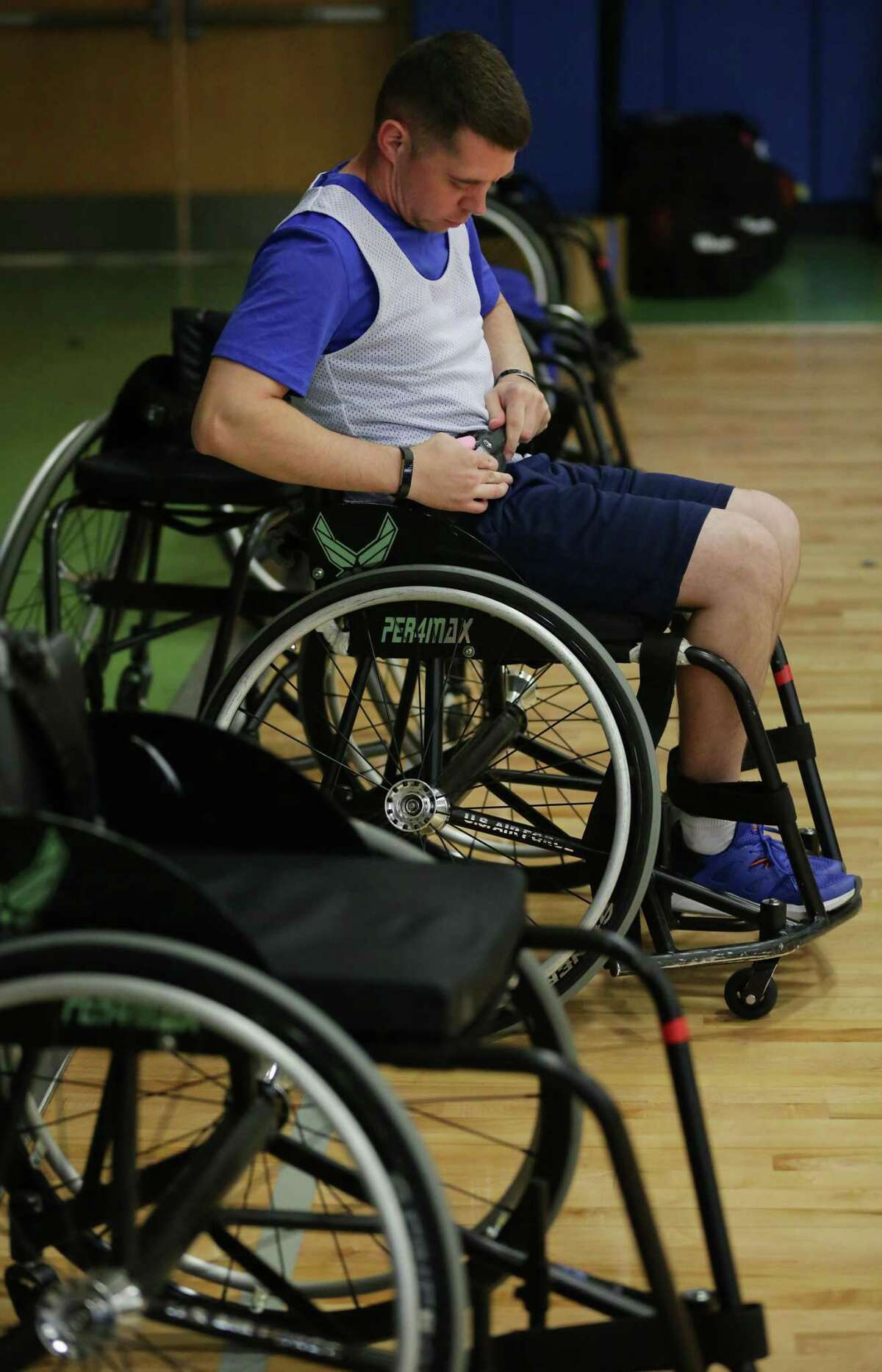 Brewer suffered PTSD Security Forces veteran Tech Sgt. Trevor Brewer, buckles in to play wheelchair basketball at the Air Force Wounded Warrior event at Joint Base San Antonio-Randolph, on Friday, Jan. 12, 2018.
