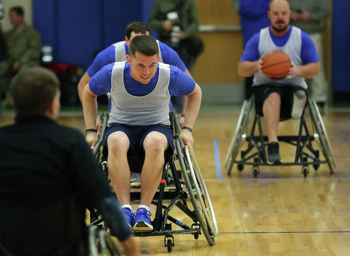 Security Forces veteran Tech Sgt. Trevor Brewer, sprints down court as he plays wheelchair basketball at the Air Force Wounded Warrior event at Joint Base San Antonio-Randolph, on Friday, Jan. 12, 2018.