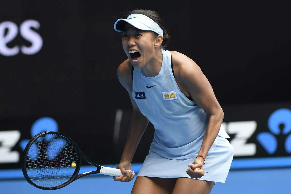China's Zhang Shuai celebrates her victory against Sloane Stephens of the US during their women's singles first round match on day one of the Australian Open tennis tournament in Melbourne on January 15, 2018. / AFP PHOTO / WILLIAM WEST / -- IMAGE RESTRICTED TO EDITORIAL USE - STRICTLY NO COMMERCIAL USE --WILLIAM WEST/AFP/Getty Images