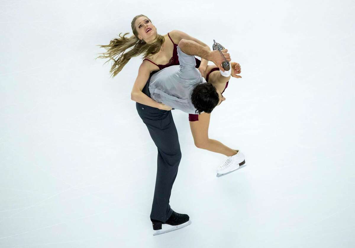 Kaitlyn Weaver, top, and Andrew Poje perform their free dance during the senior dance competition at the Canadian Figure Skating Championships in Vancouver, British Columbia, on Saturday, Jan. 13, 2018. (Darryl Dyck/The Canadian Press via AP)