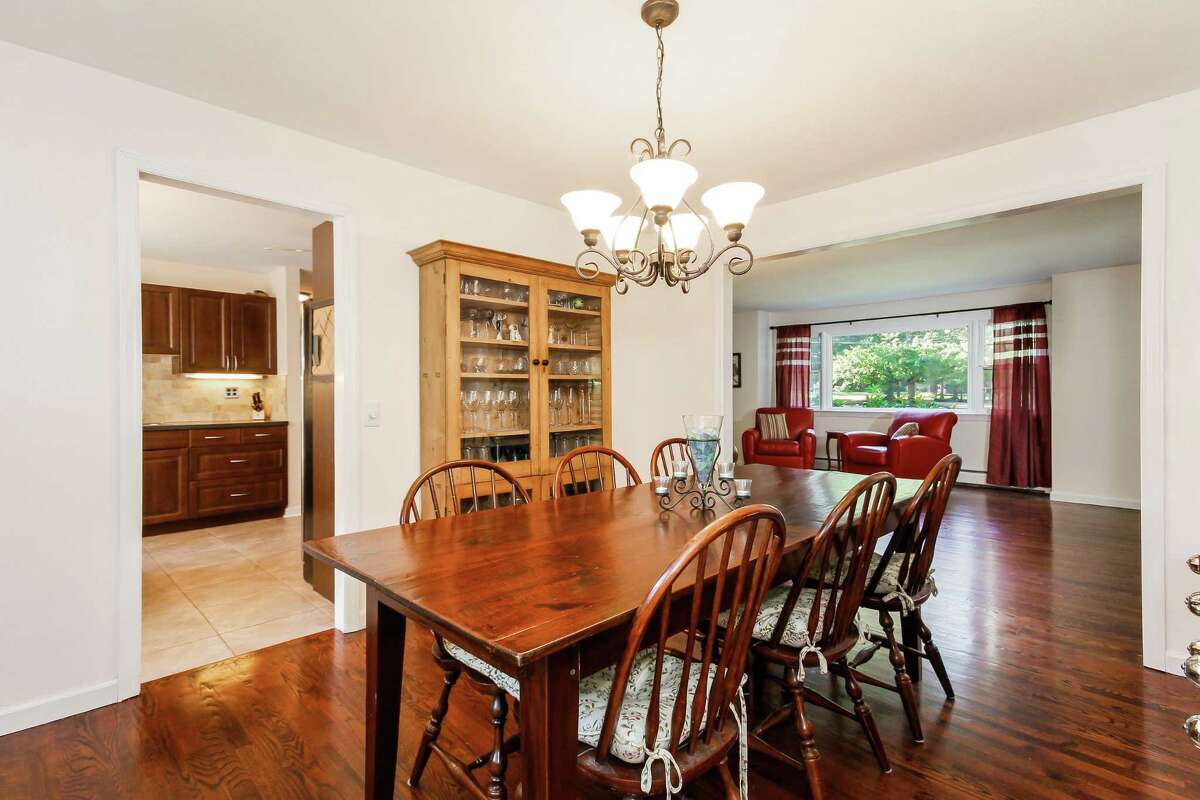 The formal dining room is open to the living room and the updated kitchen.