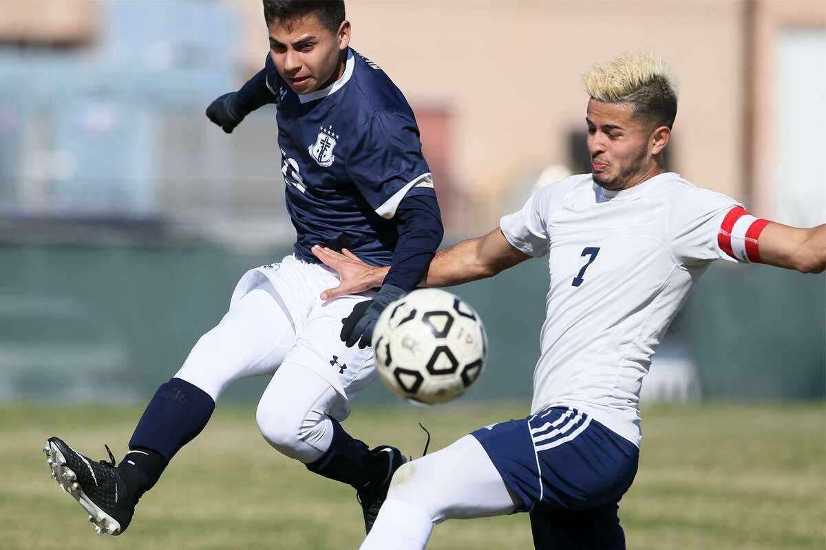 Roosevelt's Ricardo Moreno (right)) fights for the ball with Central Catholic's Jacob Jones during the first half of their high school boys soccer game in the 2018 North East Boys Soccer Tournamemt at Blossom Athletic Center East on Saturday, Jan. 13, 2018. Central Catholic beat Roosevelt 3-0. MARVIN PFEIFFER/mpfeiffer@express-news.net