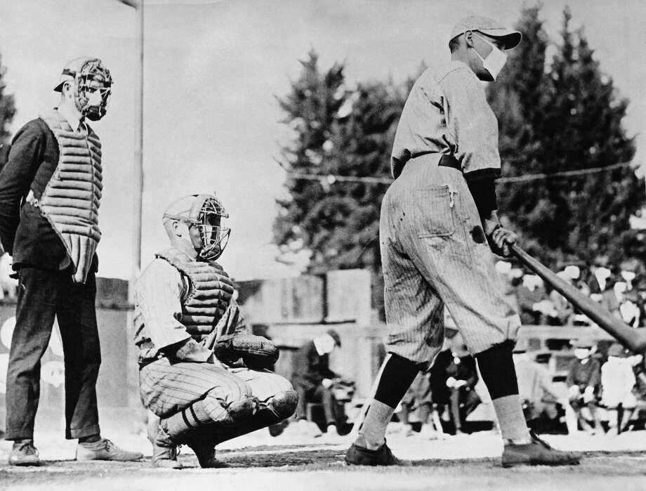 flu baseball mask 1918 wearing during pandemic spanish sports epidemic player influenza ago looked getty shows did houston corbis rinhart