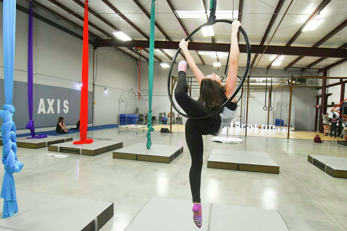 Rachel Tisdale is the owner of Axis Aerial Arts in the Cypress area. Twirling around on a pole or suspended in the air by colorful silks are just a few ways people are finding their fitness inspiration.