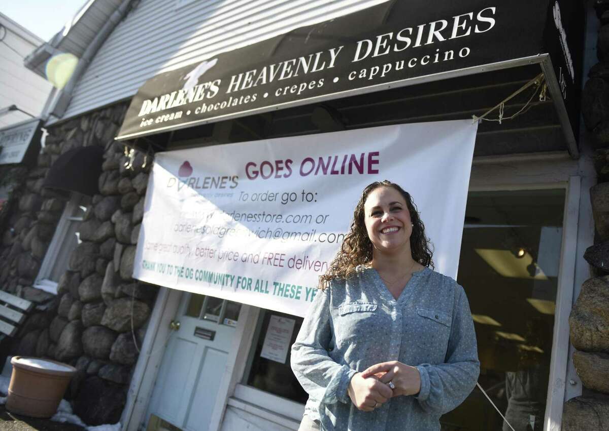 Owner Isabel Ballesteros poses outside Darlene's Heavenly Desires in Old Greenwich, Conn. Tuesday, Jan. 9, 2018. The treat shop is making a transition to online and will no longer feature a physical storefront.
