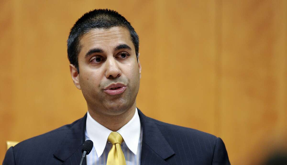 FILE--Federal Communication Commission Commissioner Ajit Pai speaking during a FCC meeting in Washington, Friday, Aug. 9, 2013. President Donald Trump designated Pai as FCC Chairman in 2017. (AP Photo/Susan Walsh)