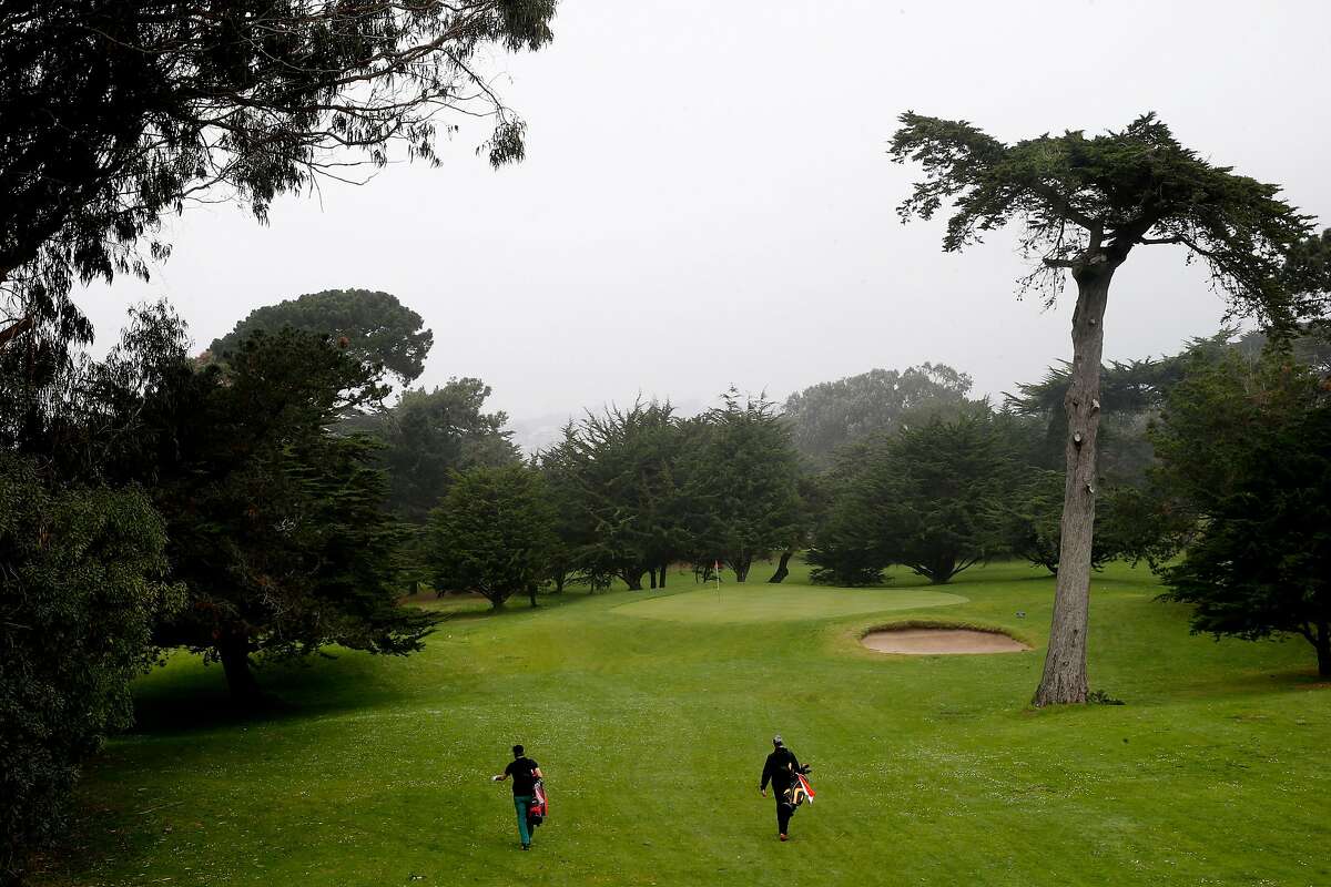 From left: Daniel Hunter and Daniel Rotstein walk to Hole 3 at the Golden Gate Park Golf Course, Tuesday, Jan. 16, 2018, in San Francisco, Calif.