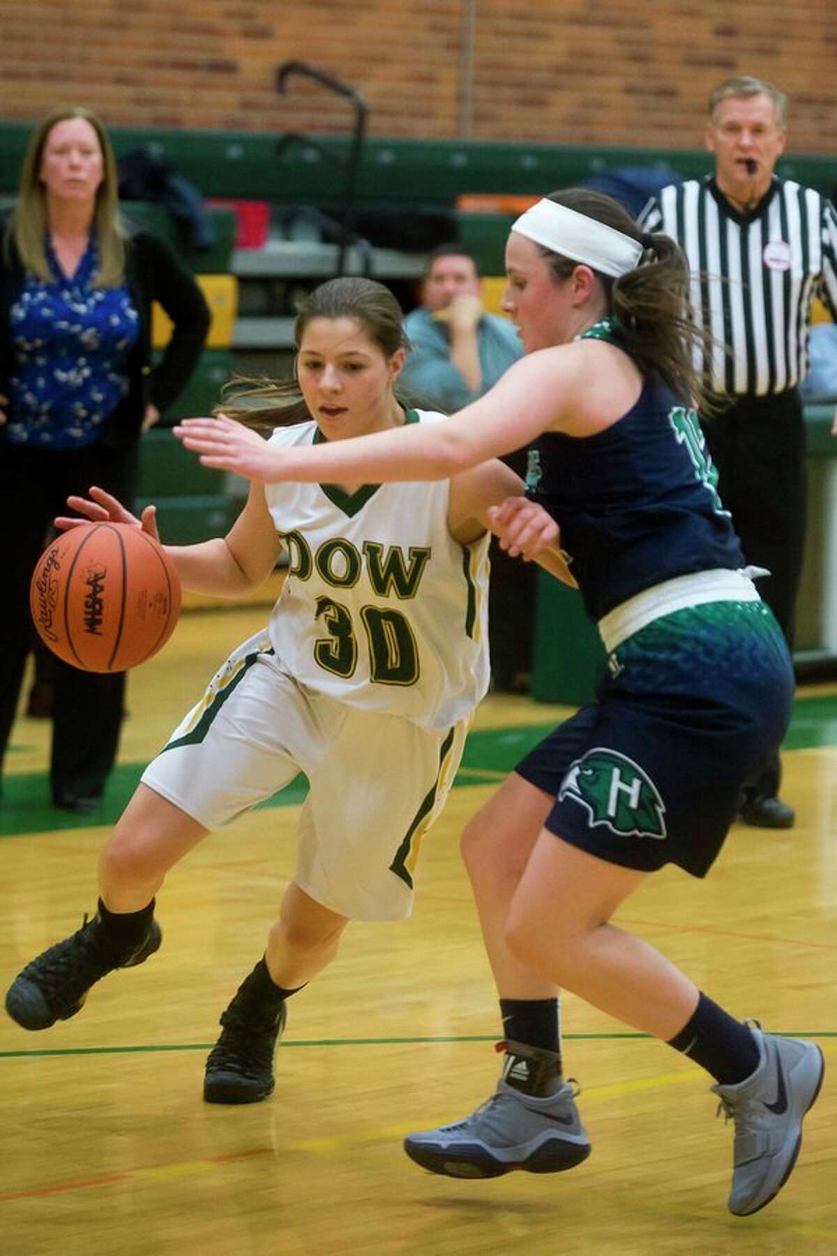 Dow freshman Katelyn Murray dribbles toward the basket during the Chargers' game against Saginaw Heritage on Tuesday at H. H. Dow High School. (Katy Kildee/kkildee@mdn.net)