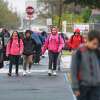 Students from Santa Maria Elementary School bundle up as classes let out early on Tuesday, Jan. 16, 2018, as a strong cold front brings near freezing temperatures to South Texas.