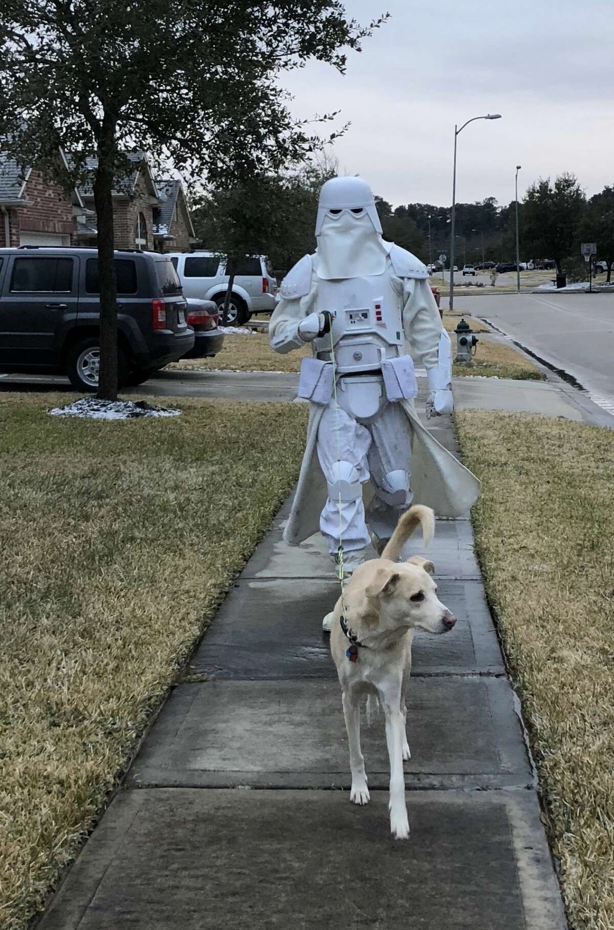 Houston man walks his dog through the cold and ice dressed as a  Stormtrooper from Hoth