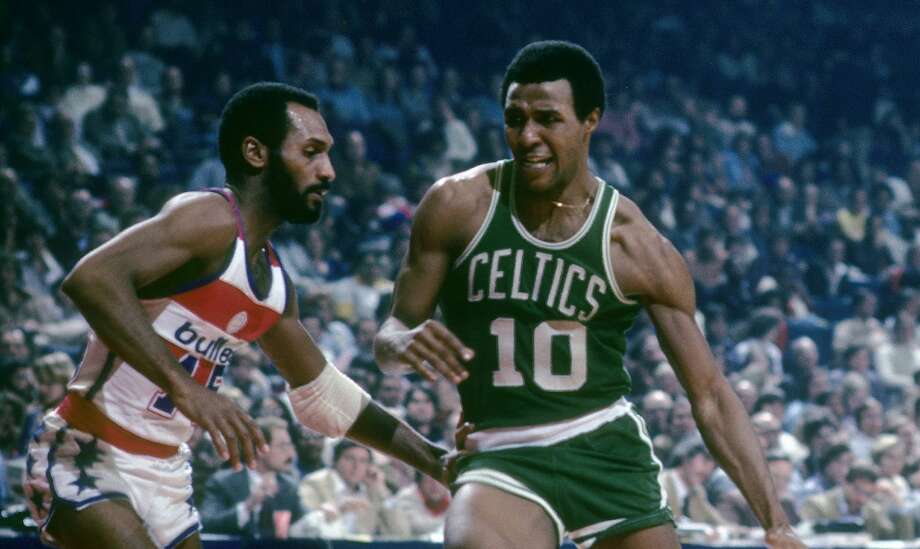 BALTIMORE, MD - CIRCA 1970's: Jo Jo White #10 of the Boston Celtics in action drives on Charles Johnson #15 of the Washington Bullets during a late circa 1970's NBA basketball game at the Baltimore Arena in Baltimore, Maryland. White played for the Celtics from 1969 - 78. (Photo by Focus on Sport/Getty Images) Photo: Focus On Sport/Getty Images