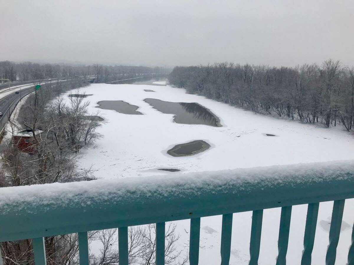 The flooded and, in parts, ice-jammed Connecticut River in upper Middlesex County Wednesday is shown from multiple vantage points, including the Arrigoni Bridge in Portland, Haddam Meadows, Eagle Landing State Park, River Road and Harbor Park in Middletown.