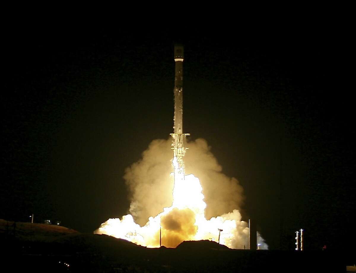 In this Friday, Dec. 22, 2017, photo, a Falcon 9 rocket lifts off from Vandenberg Air Force Base in Calif. A reused SpaceX rocket carried 10 satellites into orbit from California on Friday, leaving behind a trail of mystery and wonder as it soared into space. The Falcon 9 booster lifted off from coastal Vandenberg Air Force Base, carrying the latest batch of satellites for Iridium Communications. (Matt Hartman via AP)