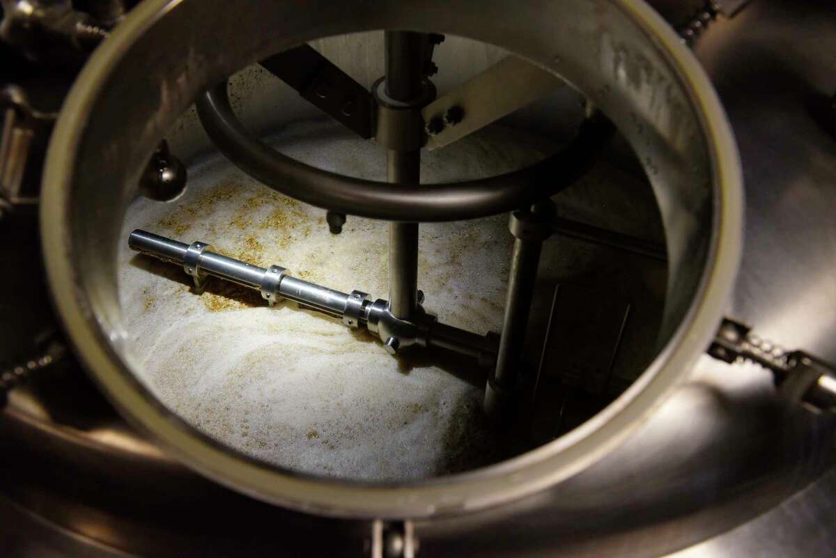 A view looking into a mash tun at Wolf Hollow Brewing Co., on Tuesday, Jan. 16, 2018, in Schenectady, N.Y. Barley and wheat are being steeped in the mash tun and when the steeping process is over the spent grains will be sent to the Cock 'n Bull Restaurant where baker, Andrea DeCiero, will used them. (Paul Buckowski/Times Union)