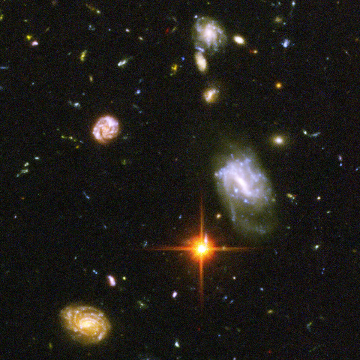 This composite photo by the Hubble Space Telescope, released Tuesday March 9, 2004 by NASA, a long-duration exposure, is the deepest-ever view of the universe, looks back to the edge of the big bang, and shows a chaotic scramble of odd galaxies smashing into each other and re-forming in bizarre shapes. The galaxies in this panel were plucked from a harvest of nearly 10,000 galaxies in the Ultra Deep Field, the deepest visible-light image of the cosmos. The image required 800 exposures taken over the course of 400 Hubble orbits around Earth. The total amount of exposure time was 11.3 days, taken between Sept. 24, 2003 and Jan. 16, 2004. (AP Photo/NASA) HOUCHRON CAPTION (07/11/2005) SECSTAR COLOR: REACHING OUT: So far, our attempts to find life in other galaxies haven't turned up anything. However, many scientists believe that we are within a generation of making contact.