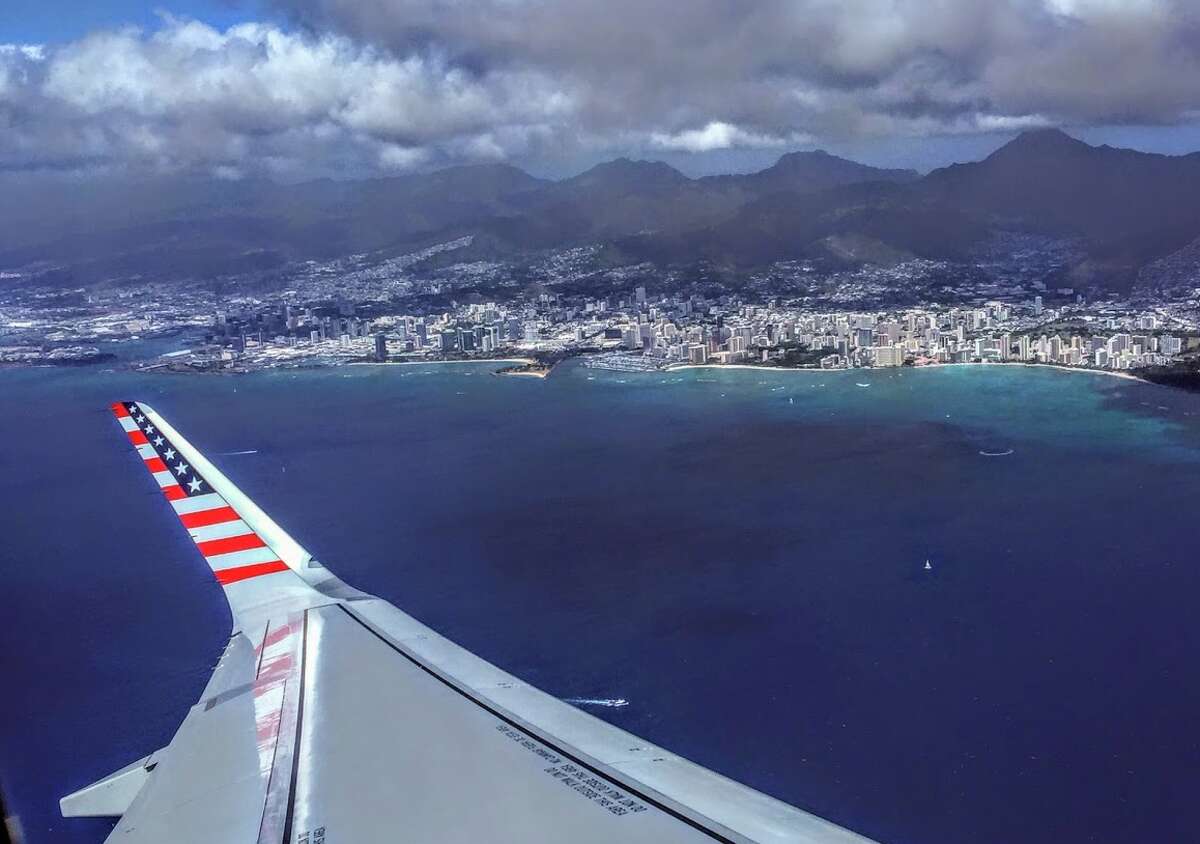 Virgin America's flashy brand and American flag wingtips will start to fade away in April. Pictured here: A Virgin America Airbus A321 taking off from Honolulu enroute to SFO