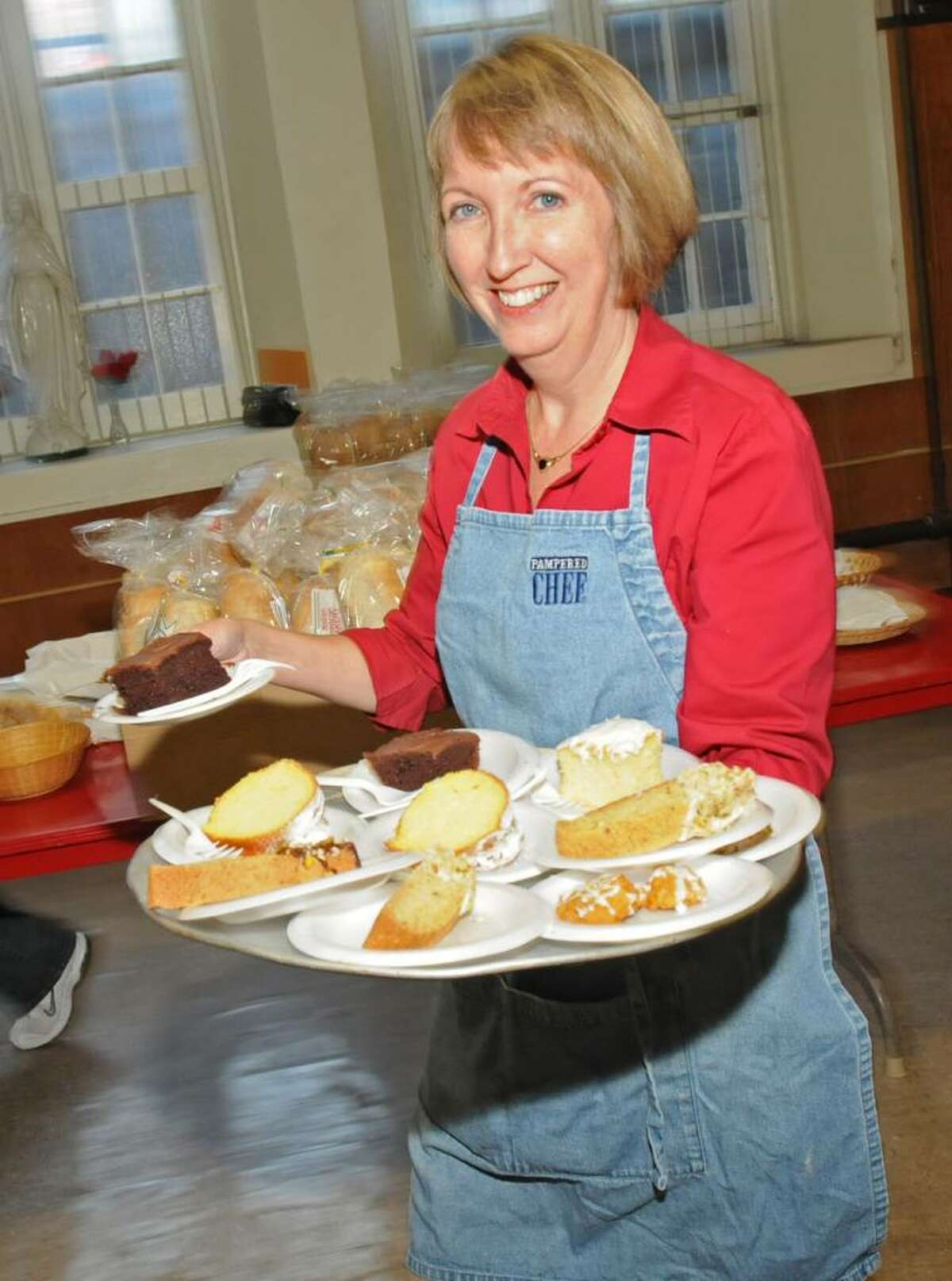 Kathleen Jimino, county executive of Rensselaer County, serves dessert at a pre-election day spaghetti dinner at St. Mary's church hall in Troy, NY on November 2, 2009. (Lori Van Buren / Times Union)