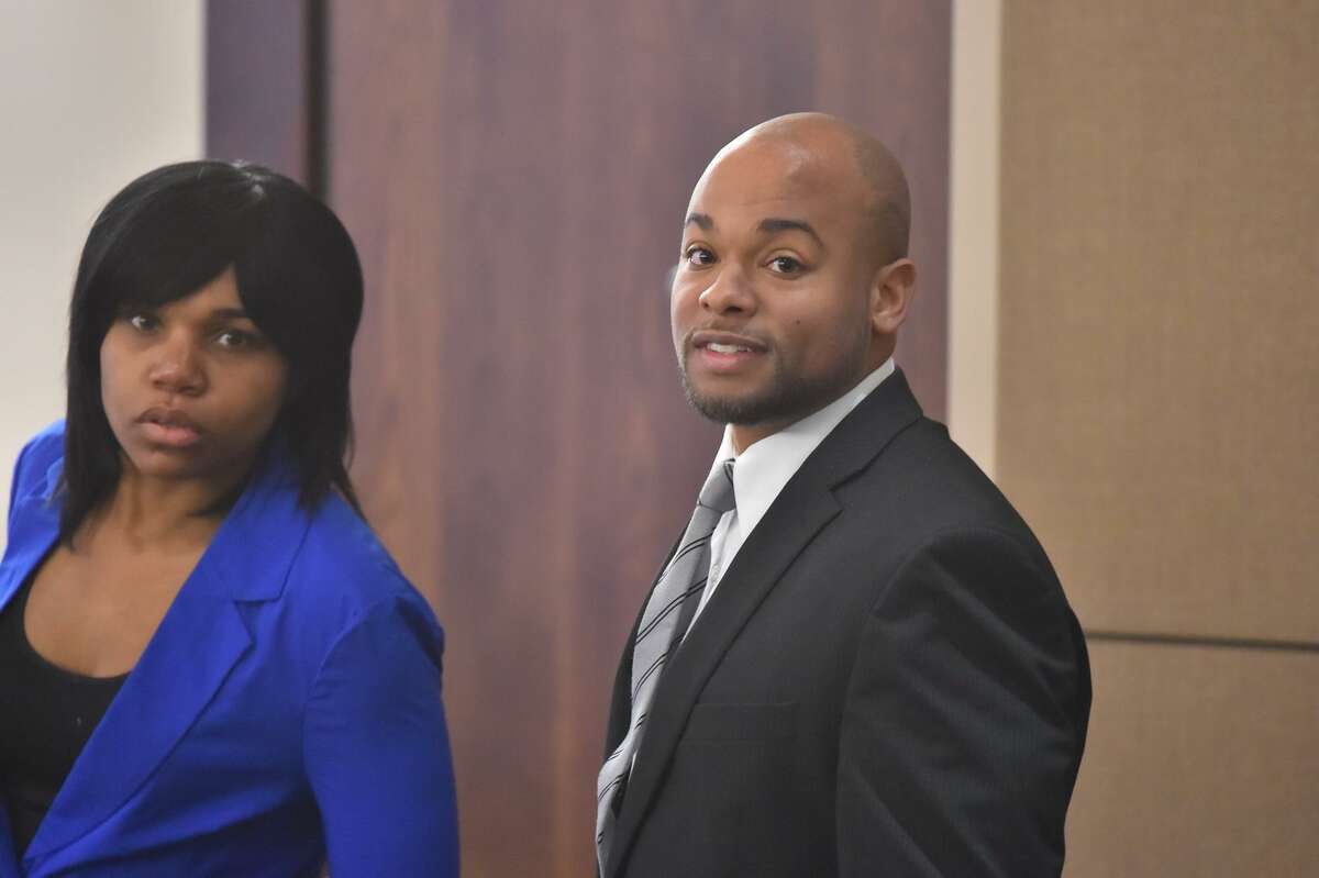 Stanyelle Miles-McCloud (left) and Alphonso McCloud arrive at the start of their dangerous dog trial in the 187th district court Thursday. They are accused of serious bodily injury after their dog viciously attacked an elderly woman, whose left arm was severed from just below the elbow.