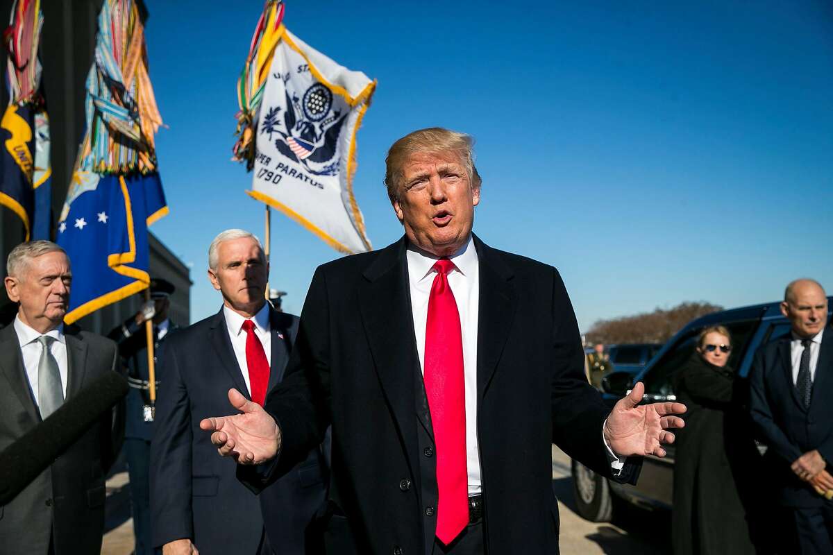 President Donald Trump speaks to reporters as he arrives with Defense Secretary James Mattis, left, Vice President Mike Pence, second from left, and White House Chief of Staff John Kelly, right, at the Pentagon in Arlington, Va., Jan. 18, 2018. (Al Drago/The New York Times)