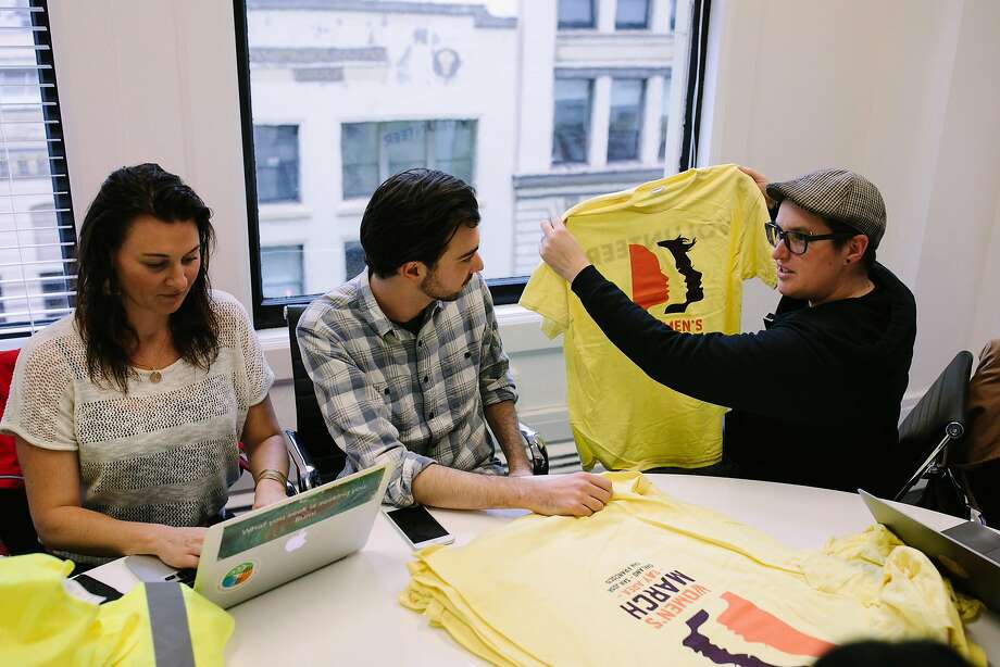 Bianca Hearfield, Edward Wright and Megan Rohrer get ready for Saturday’s Women’s March, San Francisco version. Photo: Mason Trinca, Special To The Chronicle