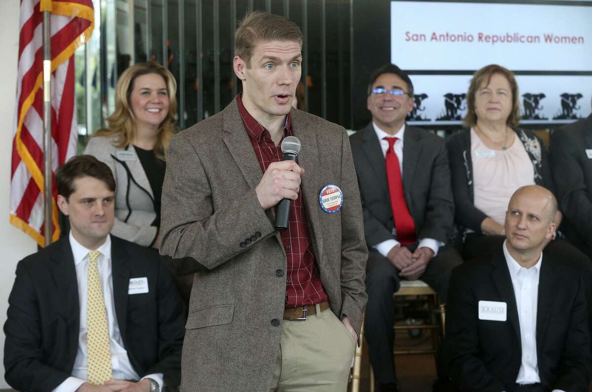 Congressional District 21 candidate Samuel Temple (fore- ground, holding the microphone) speaks on Jan. 11 at the Old San Francisco Steak- house during a meeting of the San Antonio Republican Women.