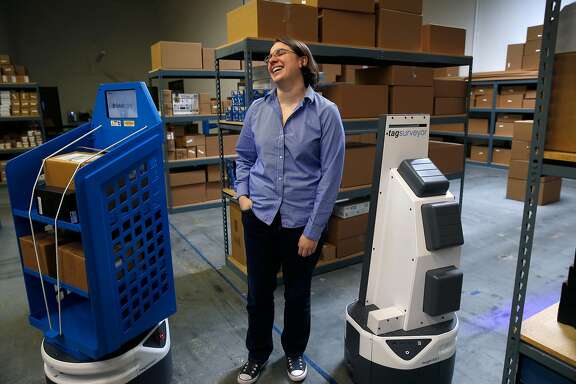 Fetch Robotics CEO Melonee Wise visits with autonomous mobile robots at the testing facility in San Jose, Calif. on Friday, Dec. 8, 2017.