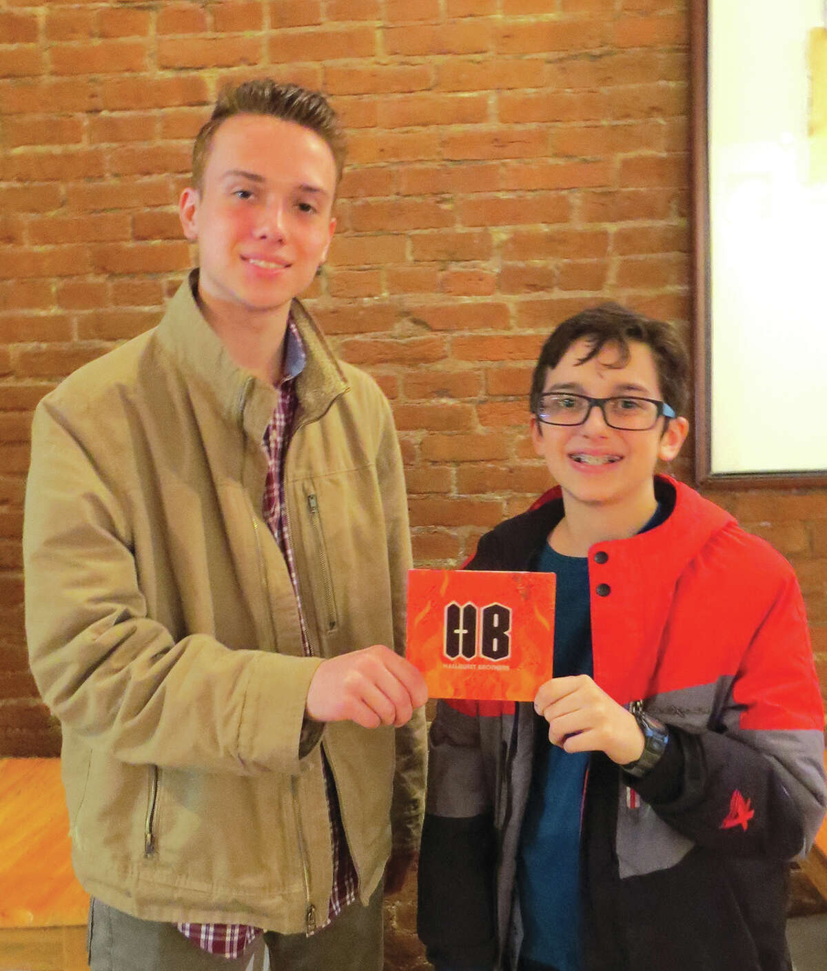 Jackson, left, and Jonah Hallquist with their five-song CD.