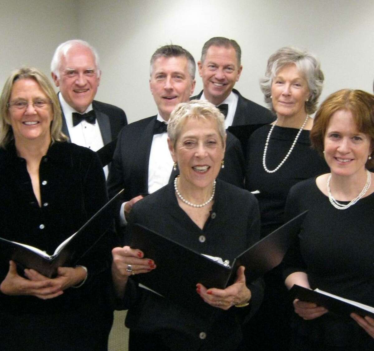 Members of the Greenwich Choral Society prepare for this weekend’s performance for the Curiosity Concert series at the Greenwich Library.