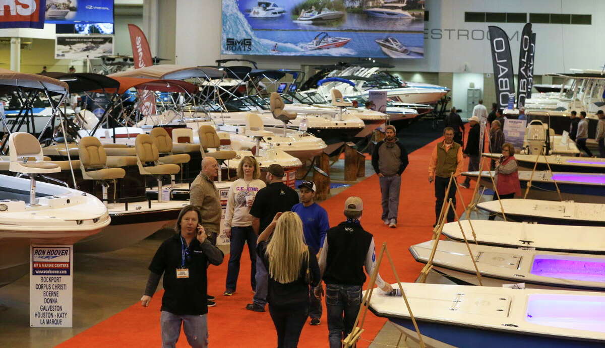 Dealers and participants walk around to see different boats at the 63rd annual Houston International Boat, Sport and Travel Show, also known as Houston Boat Show, at NRG Center on Friday, Jan. 5, 2018, in Houston. ( Yi-Chin Lee / Houston Chronicle )
