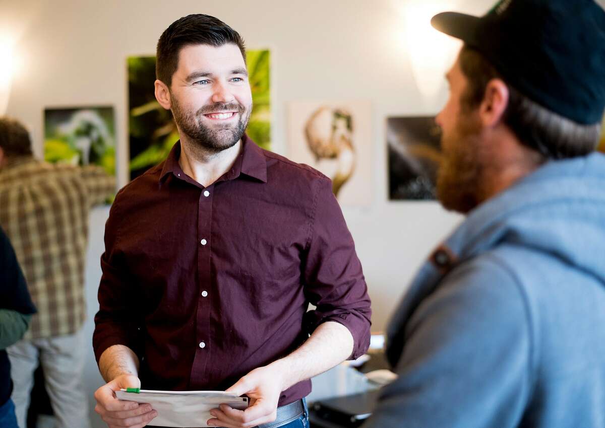 Ecological Cannabis Organization (ECO) company manager Ray Markland speaks with Matt Kurth, right, owner of Humboldt Cannabis Tours, at the Ecocann dispensary in Eureka, Calif., on Friday, Jan. 12, 2018.