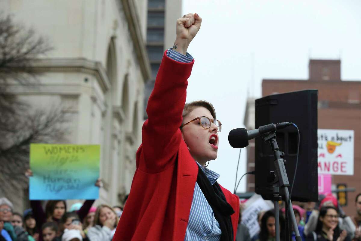 Performance artist Jessica Tilton Zertuche raises her fist while reciting her poetry of empowerment to about 500 people according to organizers gathered at Main Plaza to take part in the second annual Women's Rally on Saturday, Jan. 20, 2018. The message of the event hosted by TX23 Indivisible, was clear and decisive as speaker after speaker implored those in attendance that women's voices were not be silenced and to vote in upcoming elections. "When women vote, we win," said Cassandra Littlejohn, Bexar County Democratic Party Political Director. Toward the end of the two-hour rally, a brief march around Main Plaza came together as the event concluded.